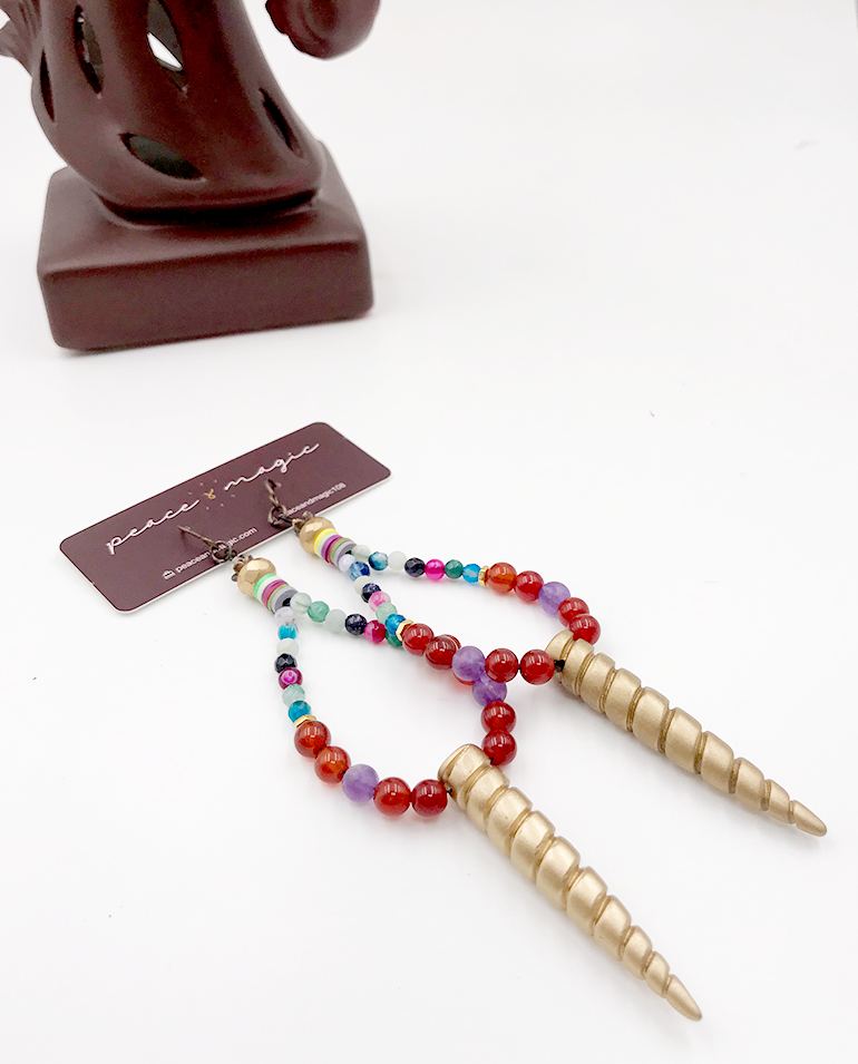 Beaded earrings with gold spiral spikes.