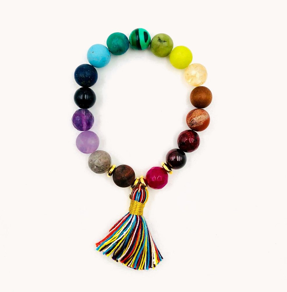 Rainbow gemstone bracelet with a multicolor tassel.