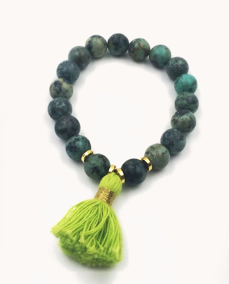 Green stone bead bracelet with a lime tassel.
