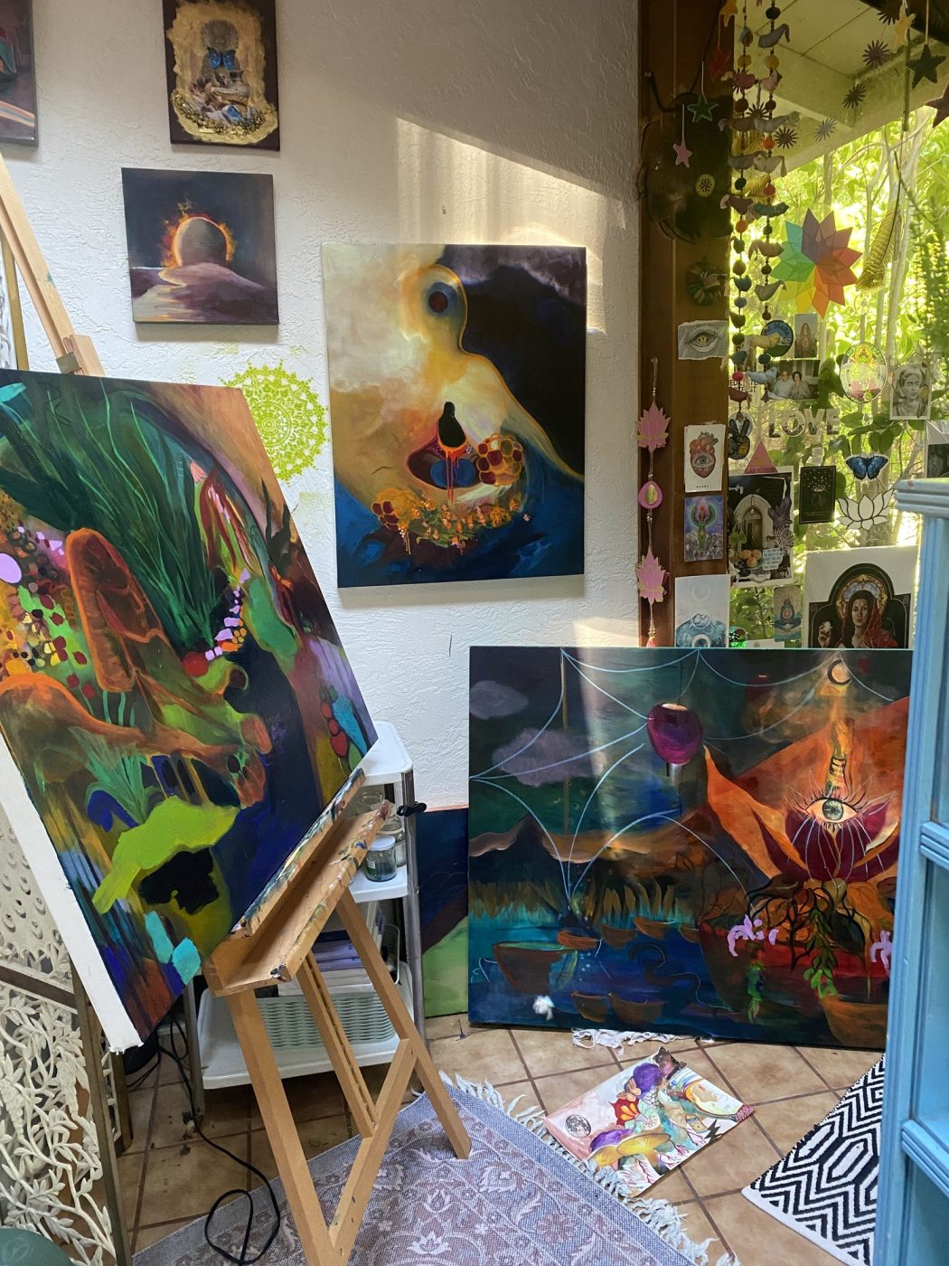 Amy’s studio corner with paintings in progress on easels.